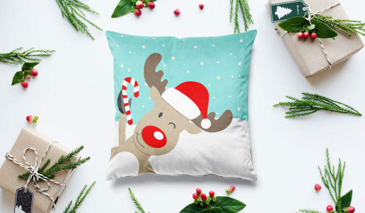 Decorative Velor Pillow Christmas reindeer - animal with a hat in snow on turquoise background 148510 additionalImage 2
