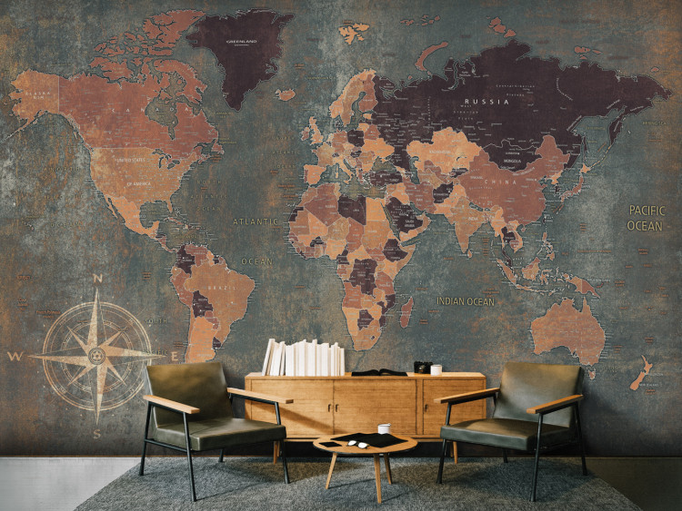 Wall Mural World in green - map of the continents on a non-uniform background with a compass