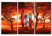 Obraz Rodzinny spacer - afrykańska rodzina z zachodem słońca i sawanną w tle 49252
