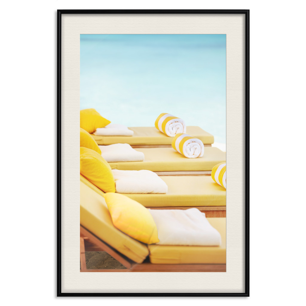 Muur Posters Summer At The Seaside - Yellow Sun Loungers On The Beach Lit By The Holiday Sun
