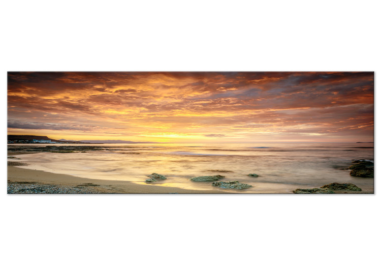 Leinwandbild Sonnenuntergang - ein Küstenpanorama in warmen Farbtönen