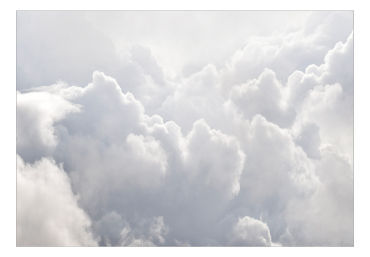 Fototapeta Widoki z okna samolotu - krajobraz gęstych białych chmur w niebie 135054 additionalImage 1
