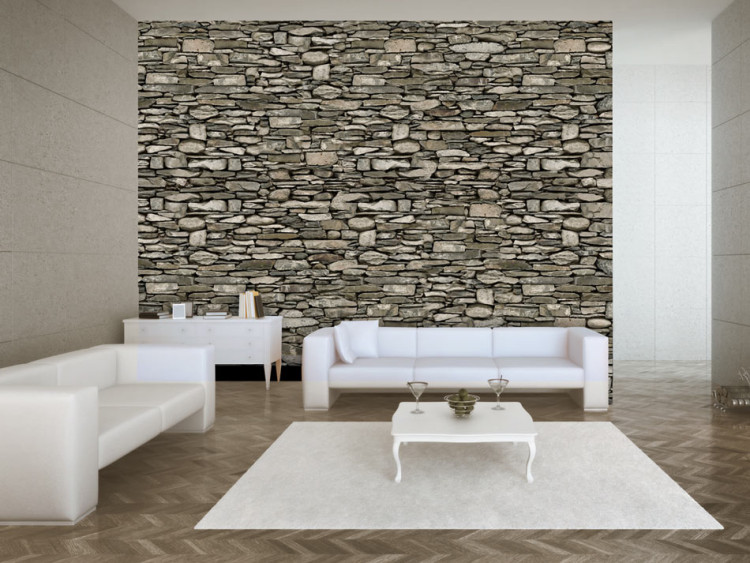 Fototapeta Mur - ściana w deseń muru z szarego kamienia o różnych kształtach 61854