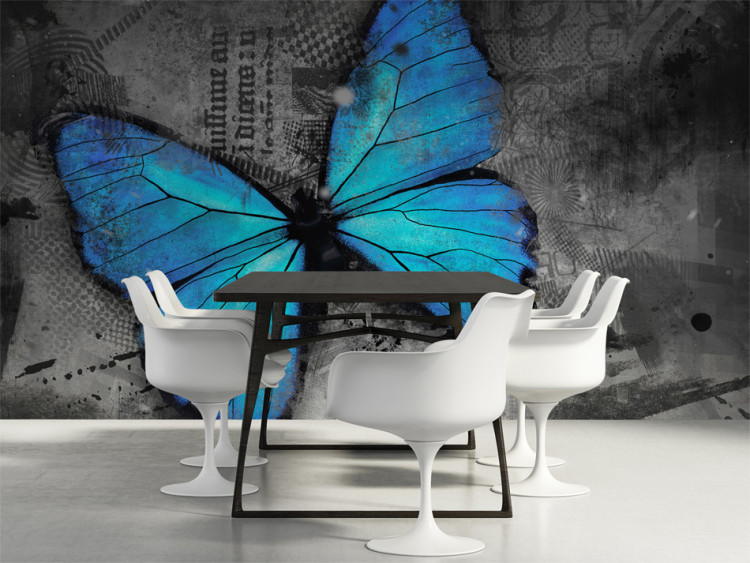 Wall Mural Beauty of the Butterfly - Blue butterfly on a graphite background with newspaper motif 61305