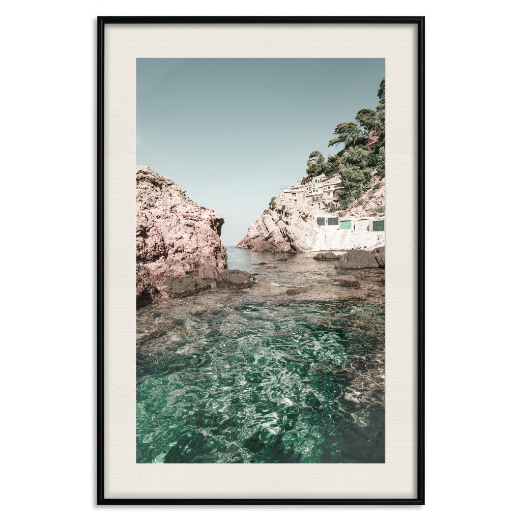 Muur Posters Rocks In The Balearic Islands - Seascape With Houses In The Background