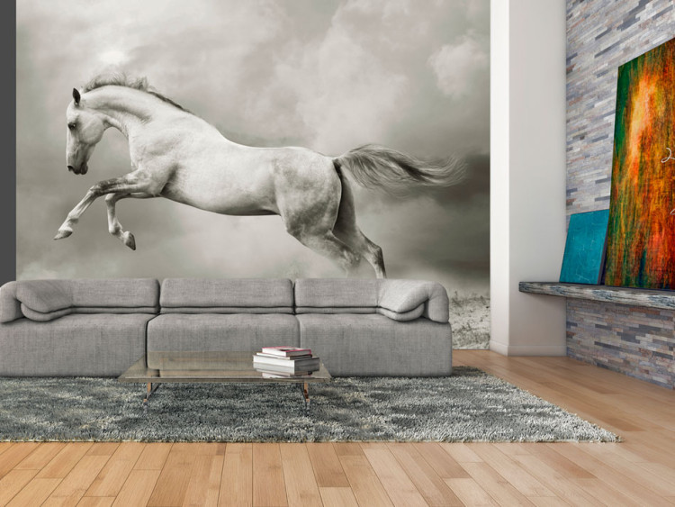 Wall Mural Strong Stallion - White jumping horse on sand amidst thick gray smoke 61267